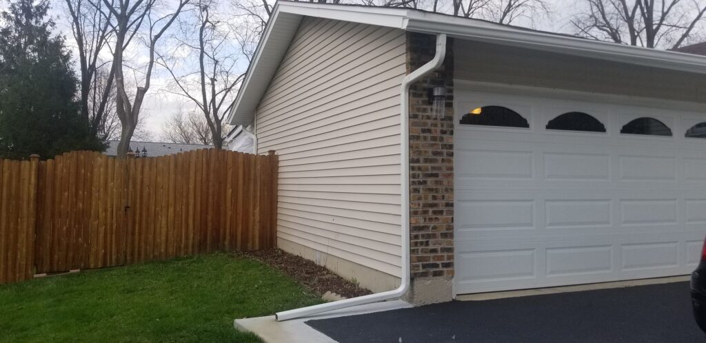 house with gutters and downspouts