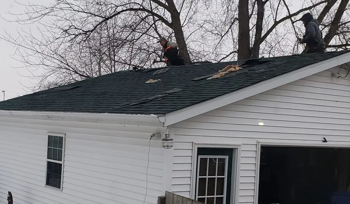 two men repairing a house roof | Roof Repair